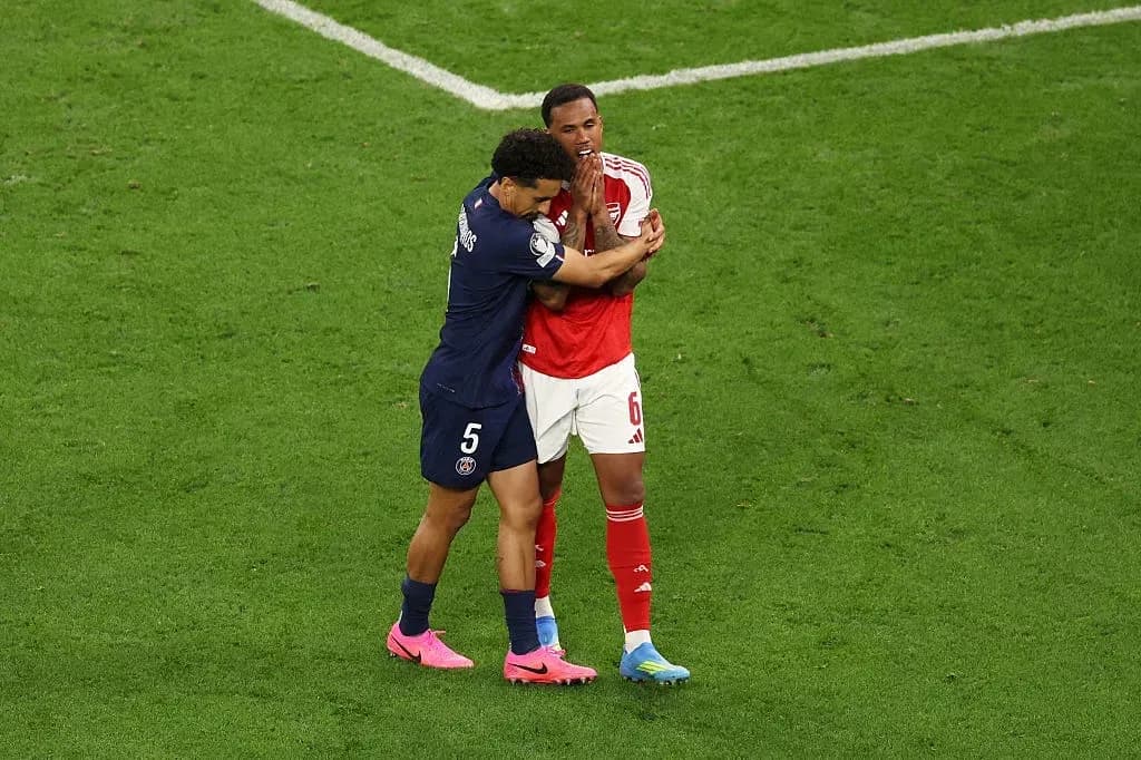 Two players embracing on the soccer field