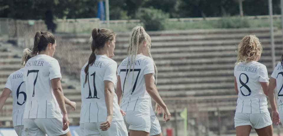 Players walking onto the field for match