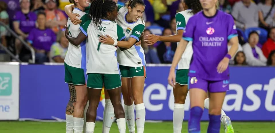 Players celebrating a goal during match