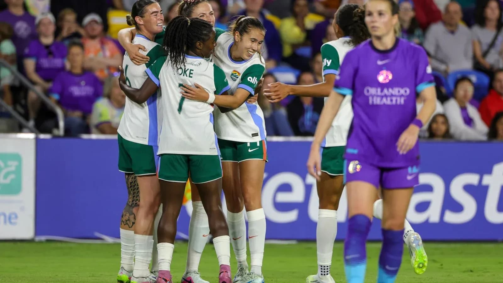 Players celebrating a goal during match