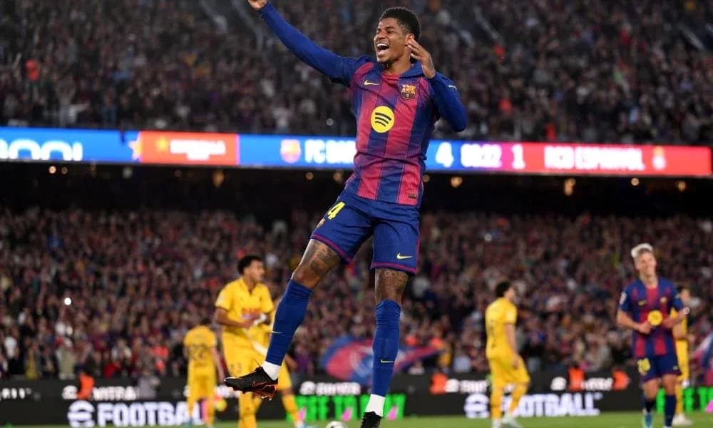 Barcelona player celebrating goal in stadium crowd