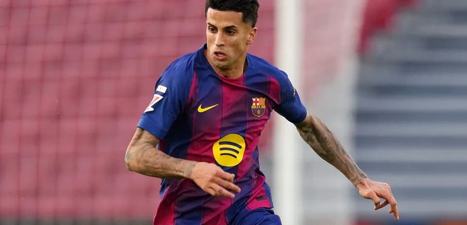 Player in FC Barcelona kit running on the pitch