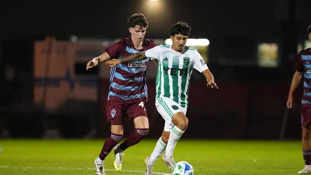 Players competing for the ball in MLS Next Pro