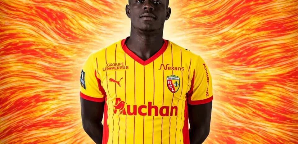 Player in yellow and red jersey with team logo