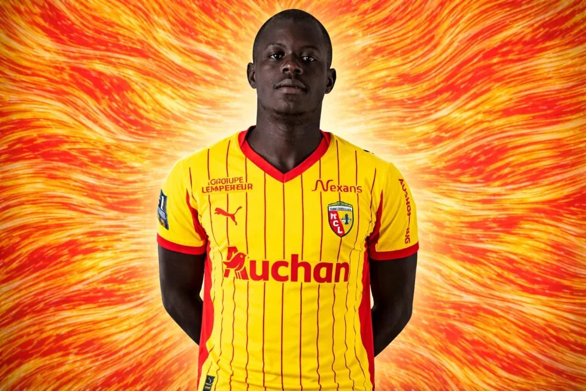 Player in yellow and red jersey with team logo