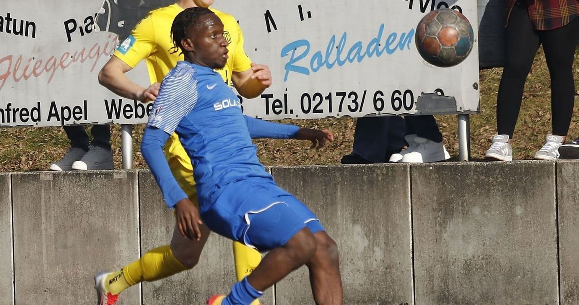 Player tackling during Büderich vs SF Baumberg match