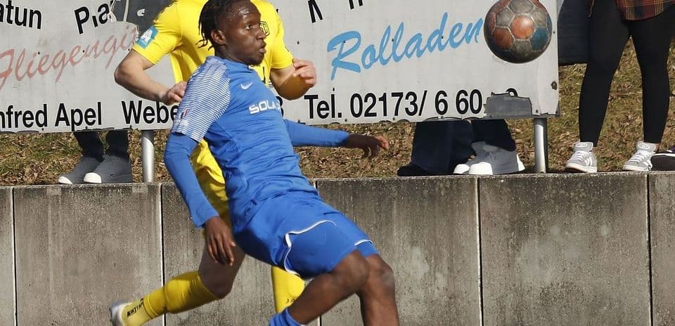 Player tackling during Büderich vs SF Baumberg match