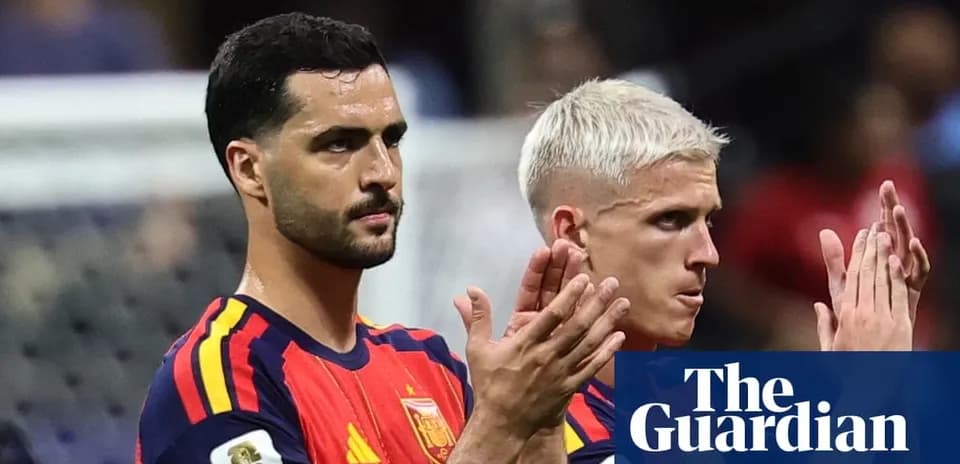 Two Spain players applauding after match