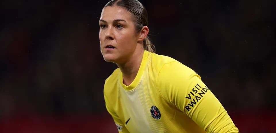 Goalkeeper in yellow kit during match action