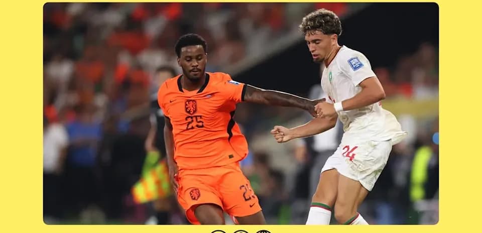 Players from Netherlands and Morocco contesting for the ball
