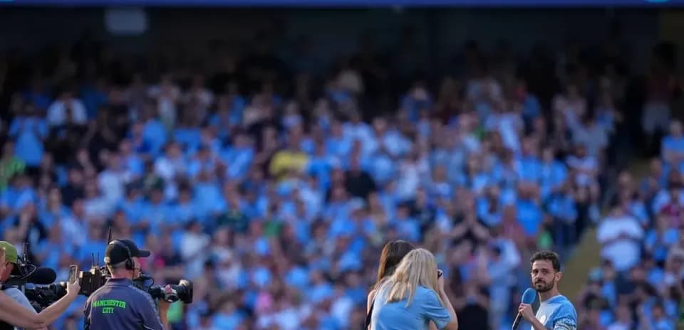 Player speaking to fans during farewell event