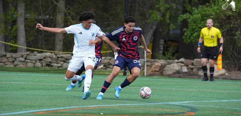 Players competing for the ball in match
