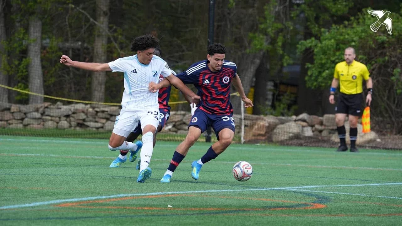 Players competing for the ball in match