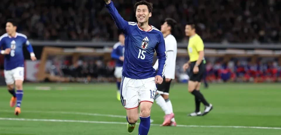 Japanese player celebrating during football match
