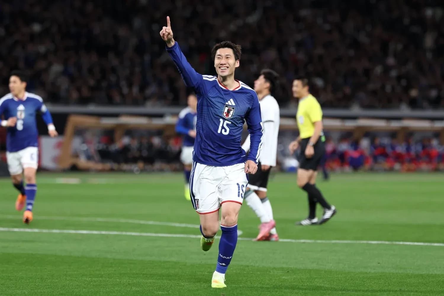 Japanese player celebrating during football match