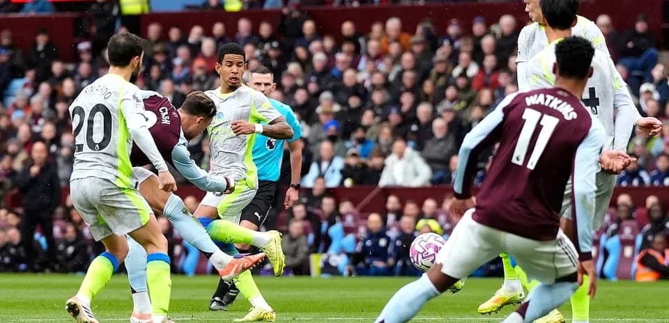 Players contesting the ball during Manchester City match