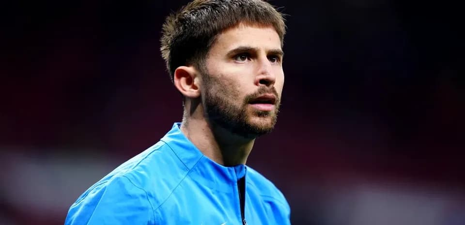Player in blue training kit looking focused