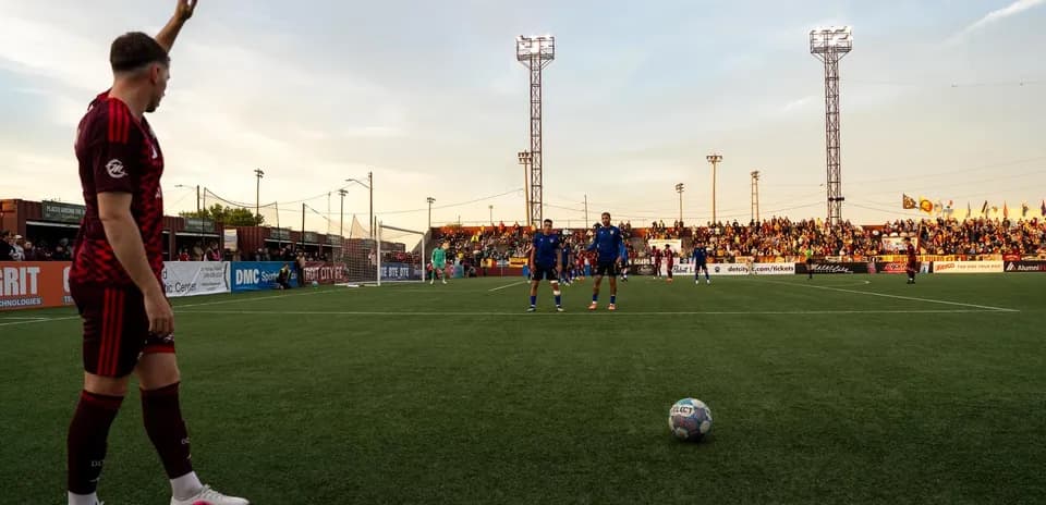 Player preparing for a corner kick during match
