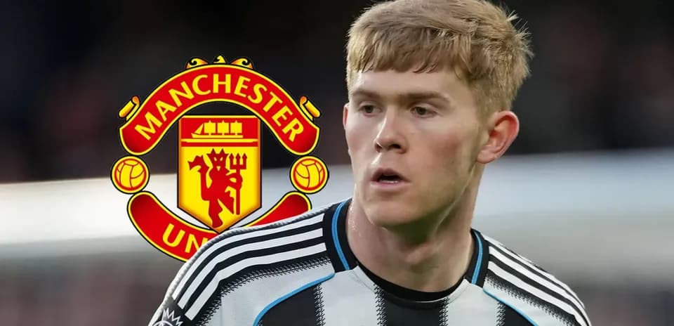 Player in black and white jersey near Manchester United logo
