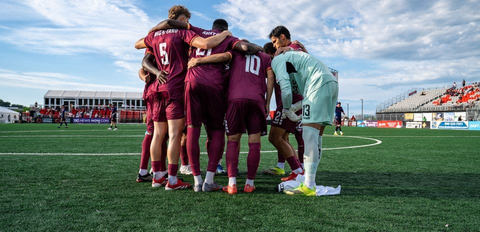 Team huddle before the match at Loudoun United