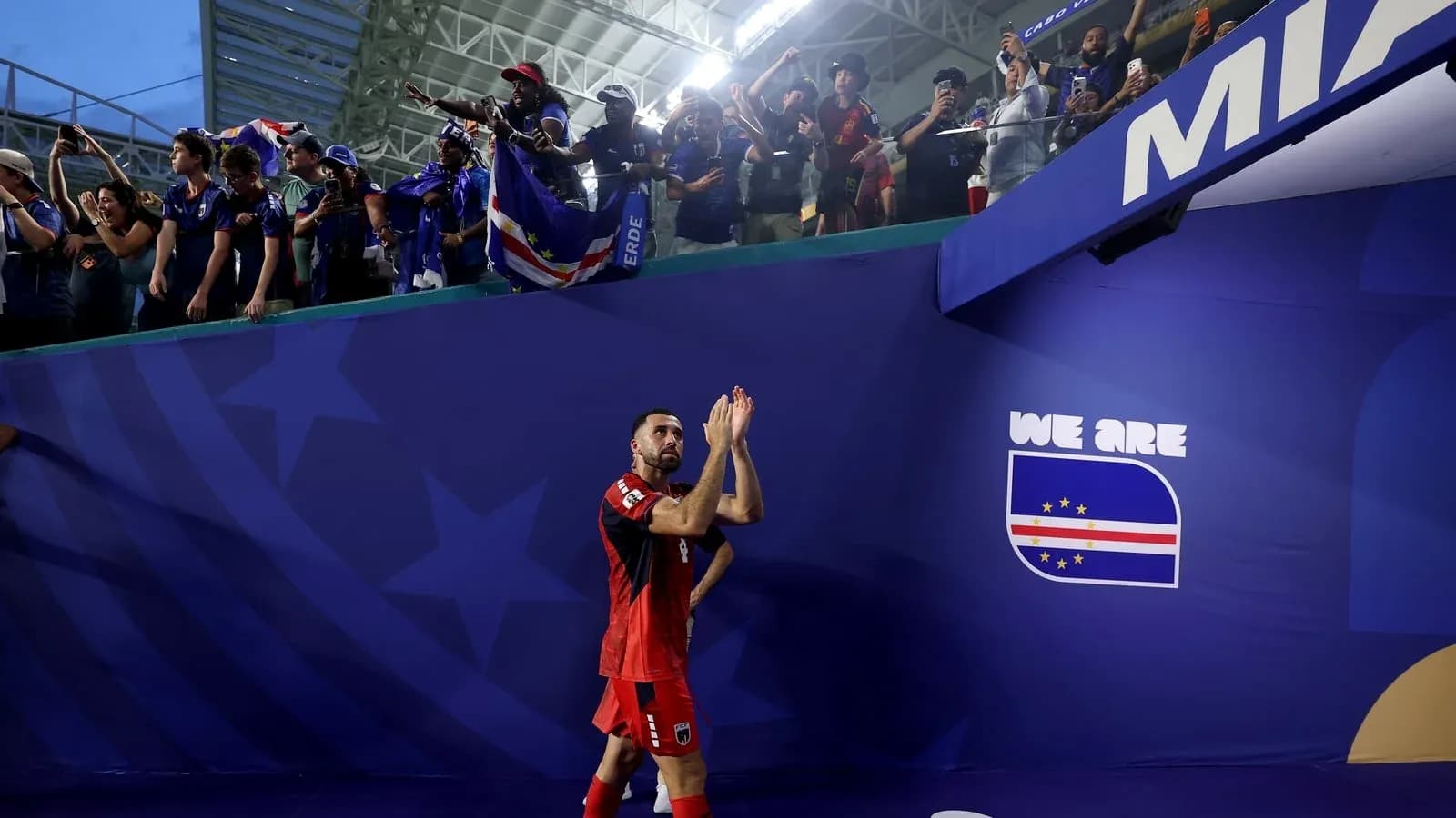 Player applauding fans after the match