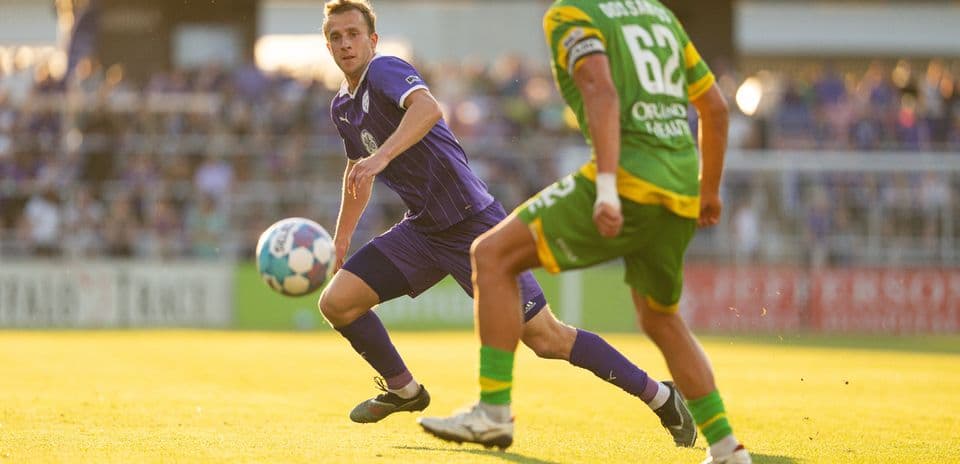 Louisville City player dribbling against Tampa Bay Rowdies