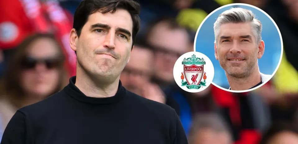 Coach looking thoughtful during match with Liverpool logo