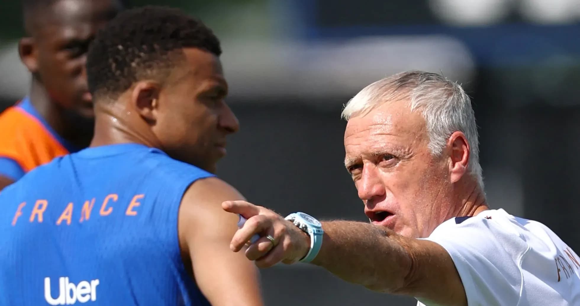 France coach instructing players during training session