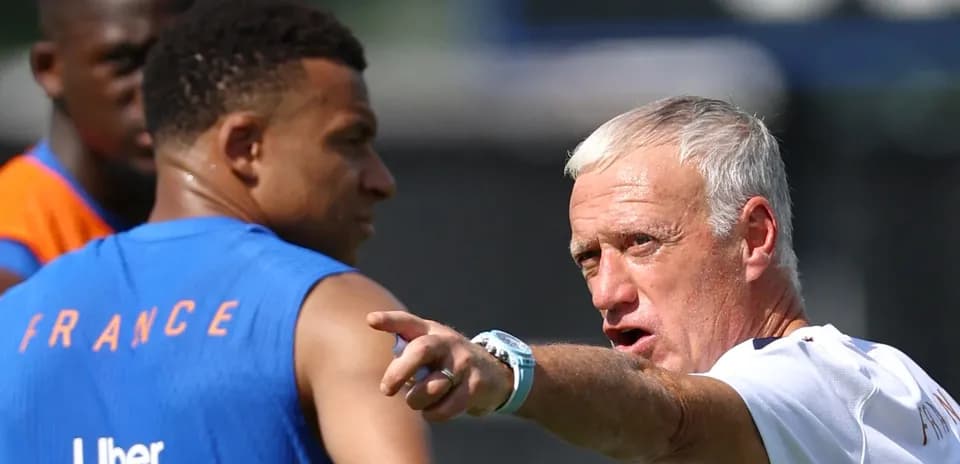 France coach instructing players during training session