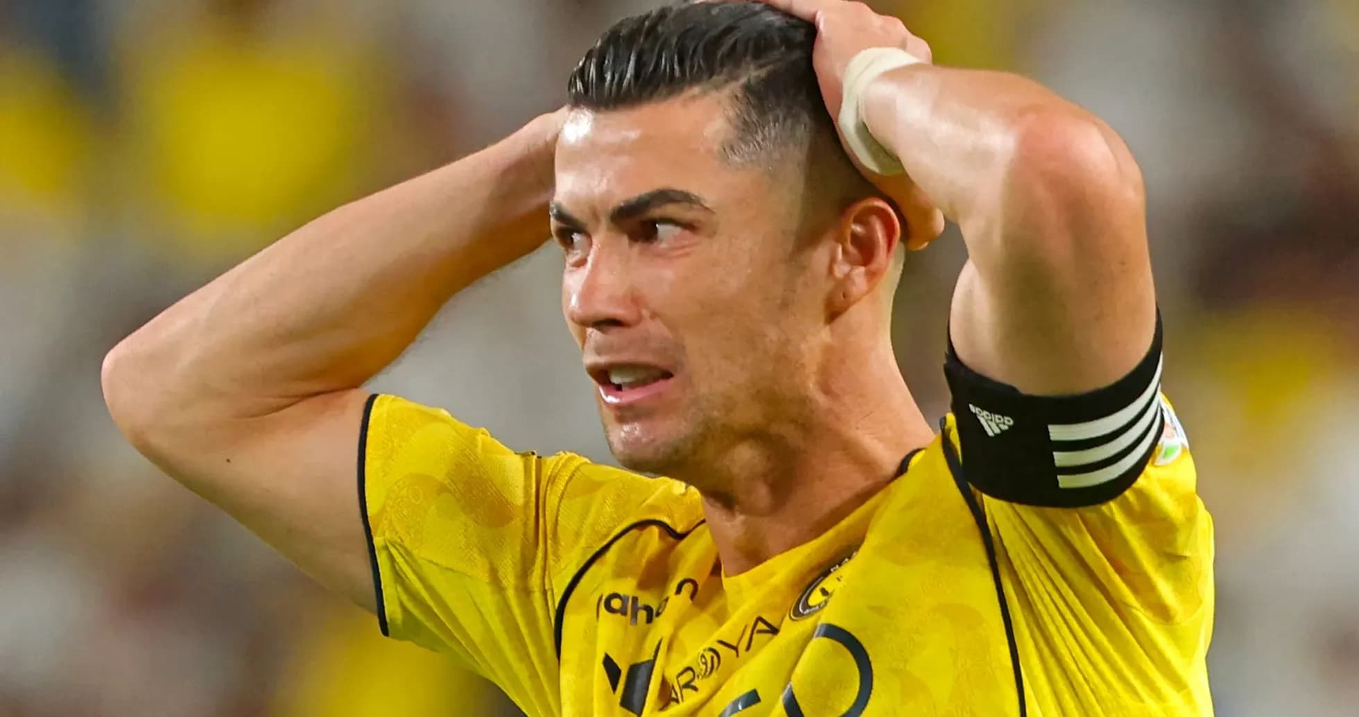 Player in yellow jersey reacting with frustration