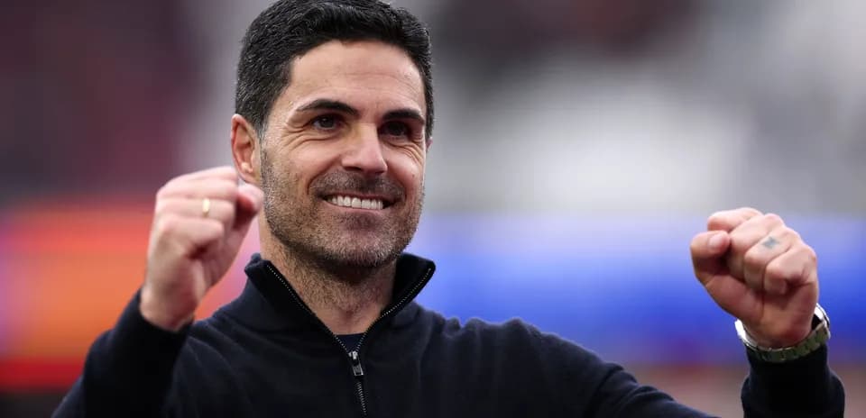 Coach celebrating with raised fists during match