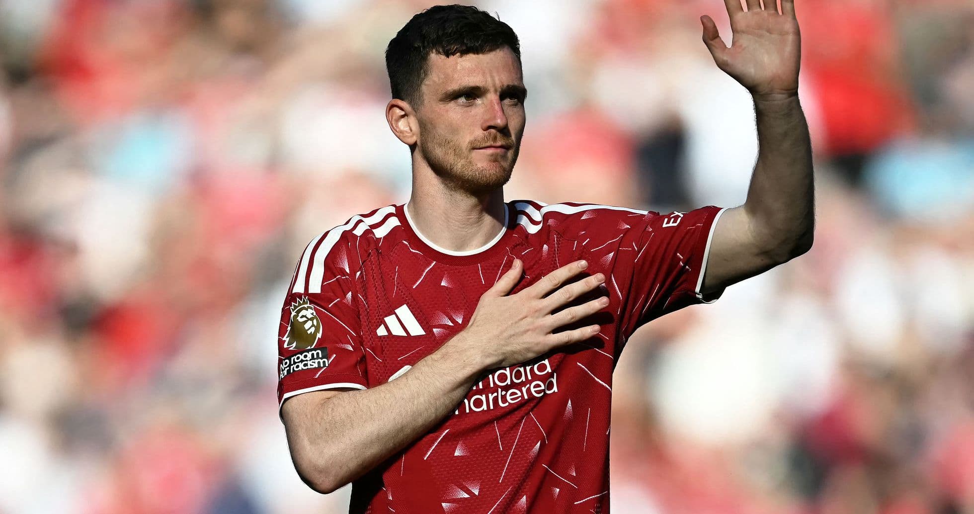 Player waving with hand on heart gesture