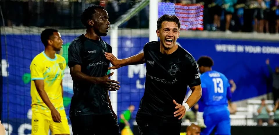 Players celebrating a goal during USL Championship match