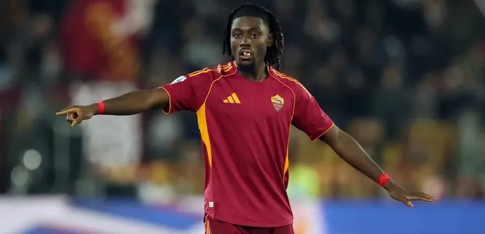 Player gesturing during match in AS Roma jersey
