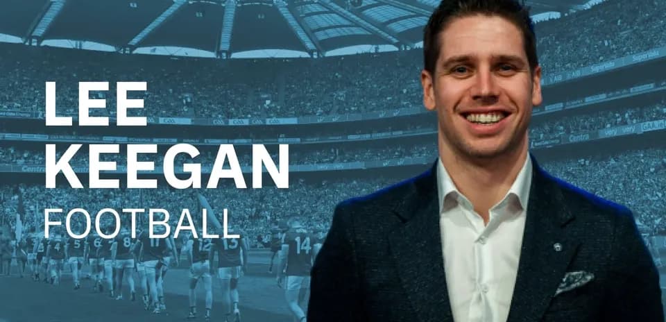 Lee Keegan smiling in front of a stadium crowd