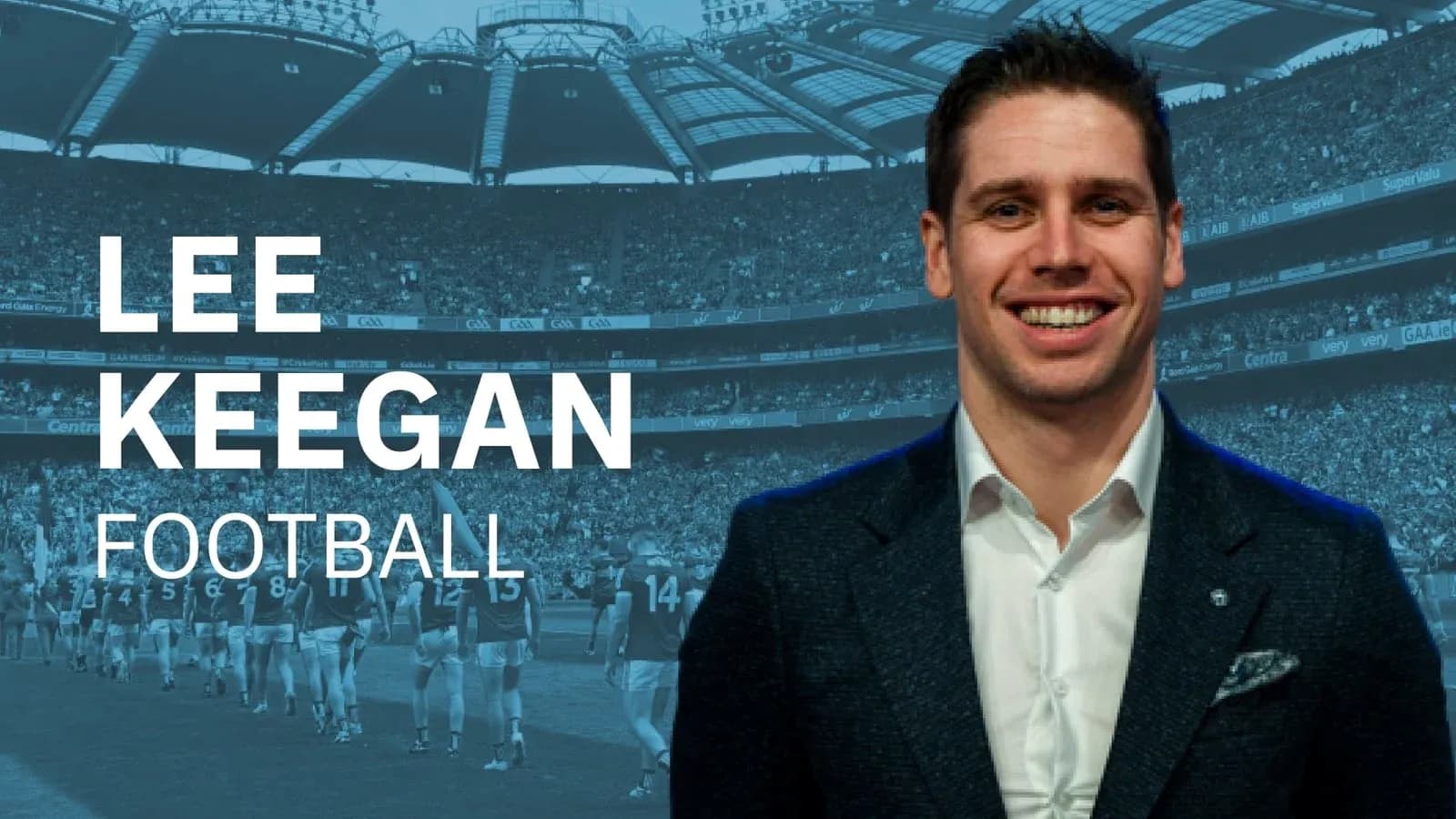 Lee Keegan smiling in front of a stadium crowd