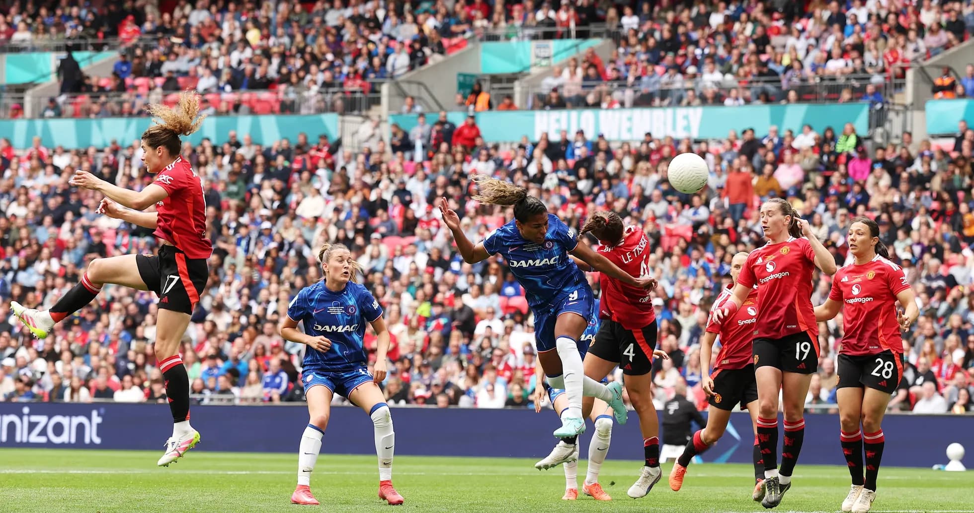 Players contesting for the ball during match