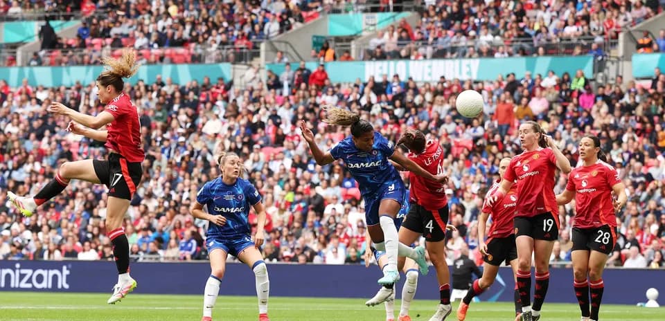Players contesting for the ball during match
