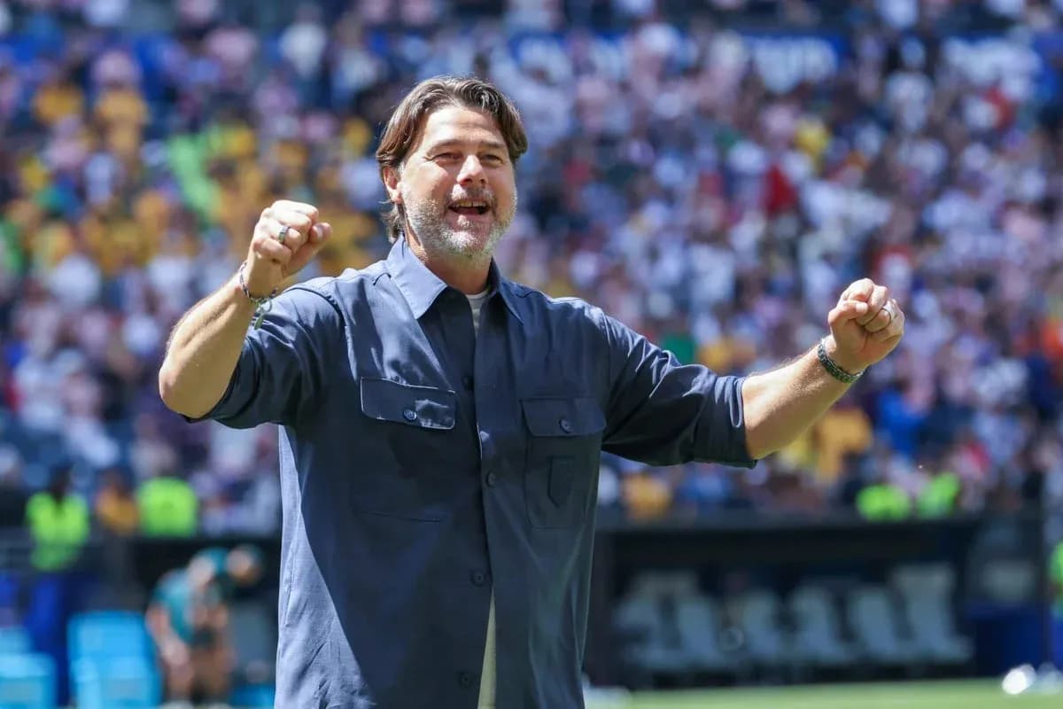Coach celebrating enthusiastically during a match