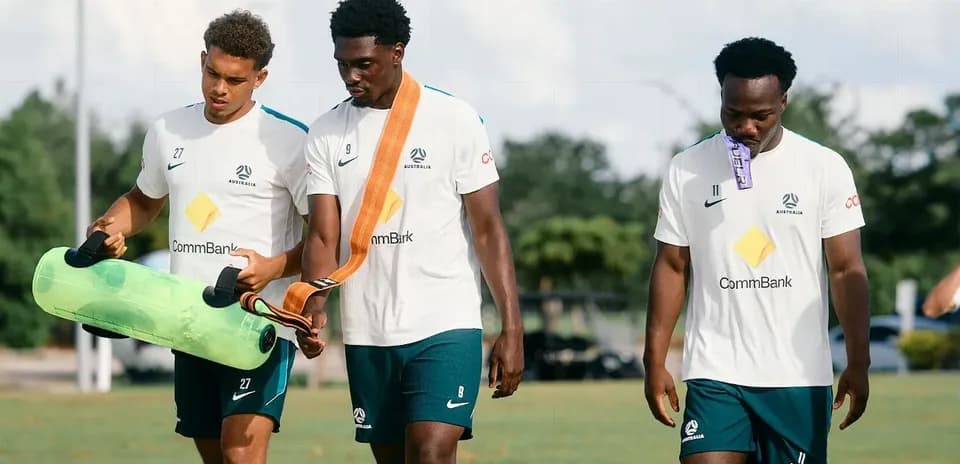 Three players walking during training session
