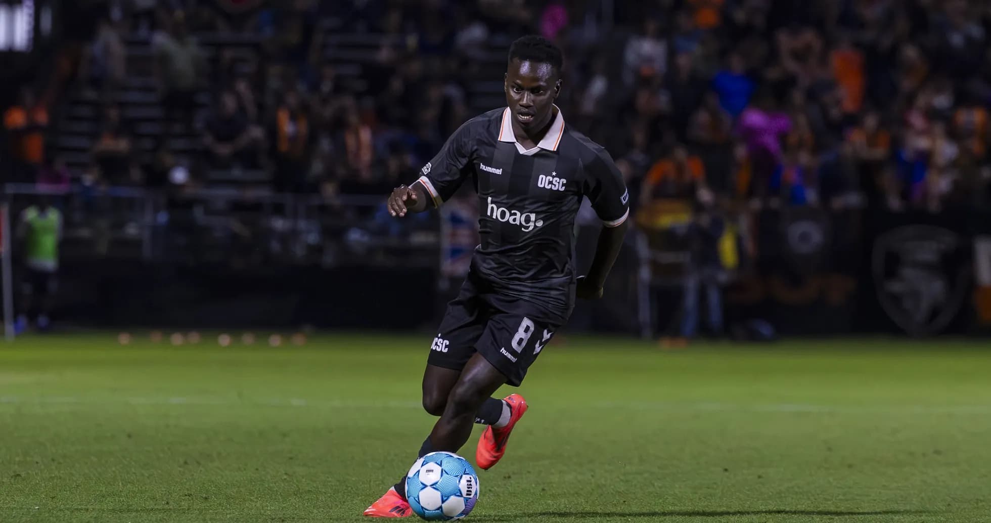 Player dribbling the ball during Miami FC match