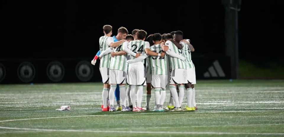 Players huddling before MLS Next Pro match
