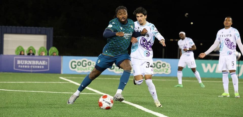 Player dribbling ball during Pacific FC match