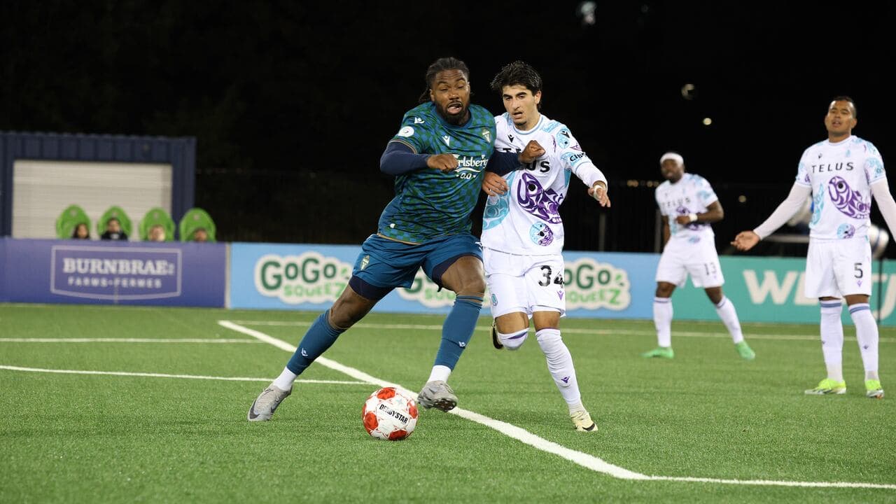 Player dribbling ball during Pacific FC match
