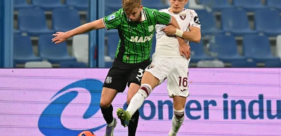 Player tackling during Torino vs Sassuolo match