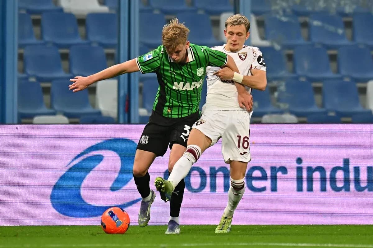 Player tackling during Torino vs Sassuolo match