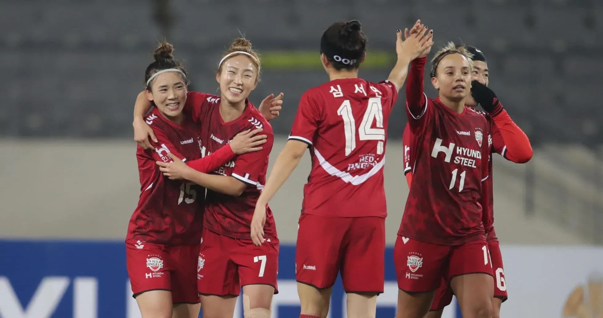 Players celebrating a goal in WK-League match