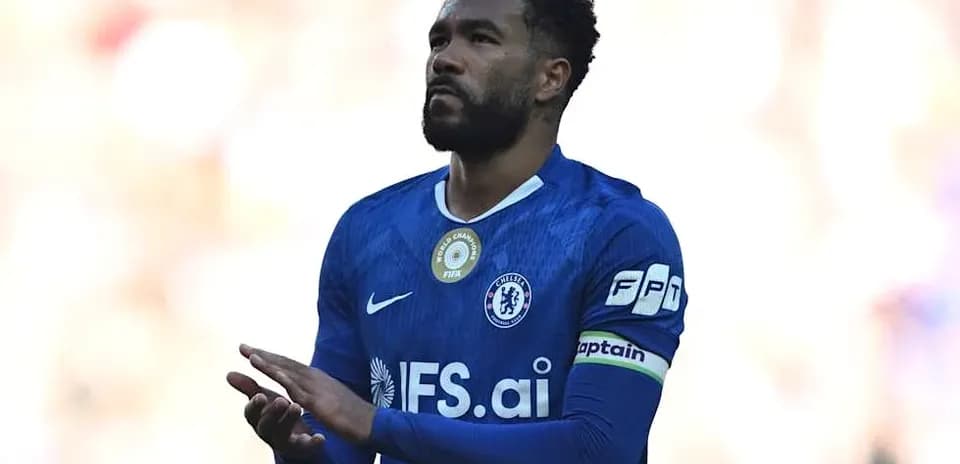 Chelsea player applauding fans during match