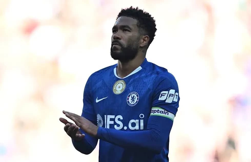 Chelsea player applauding fans during match