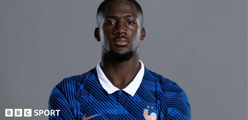 Football player wearing France national team jersey